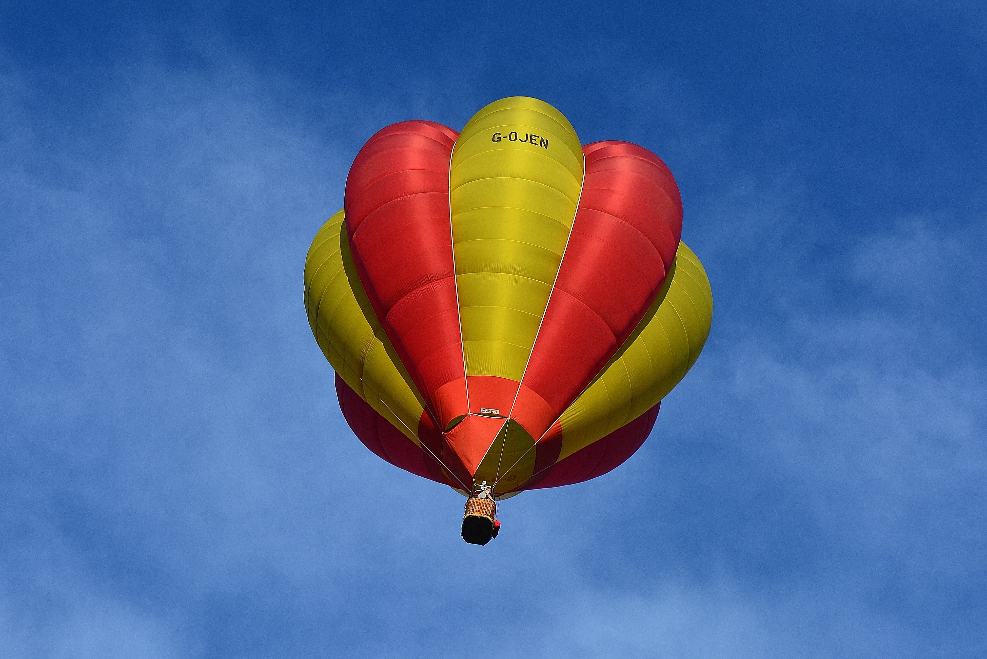 Yellow and red hot air balloon in sky photo