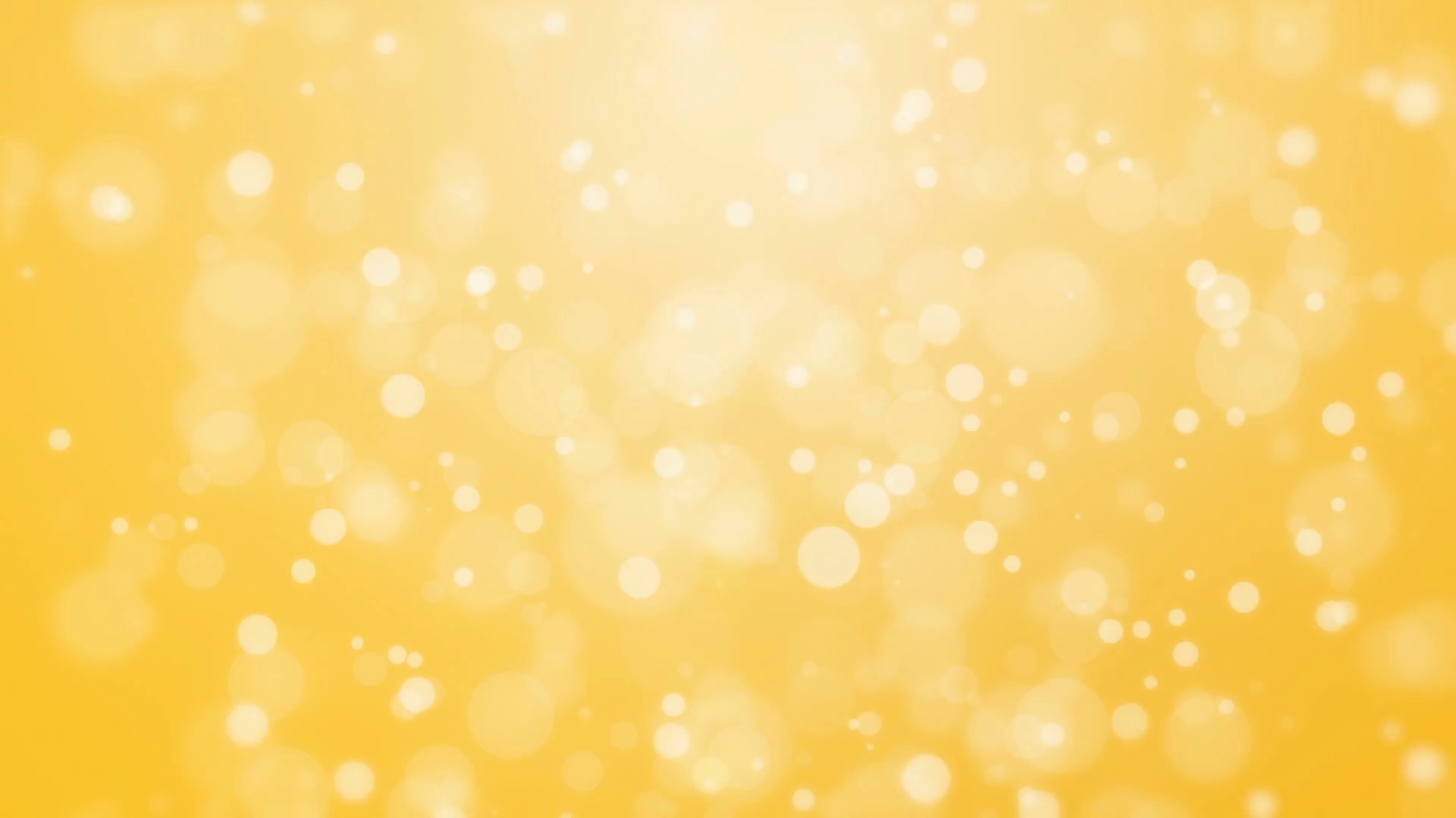 Cheerful golden yellow bokeh background with floating glowing lights ...