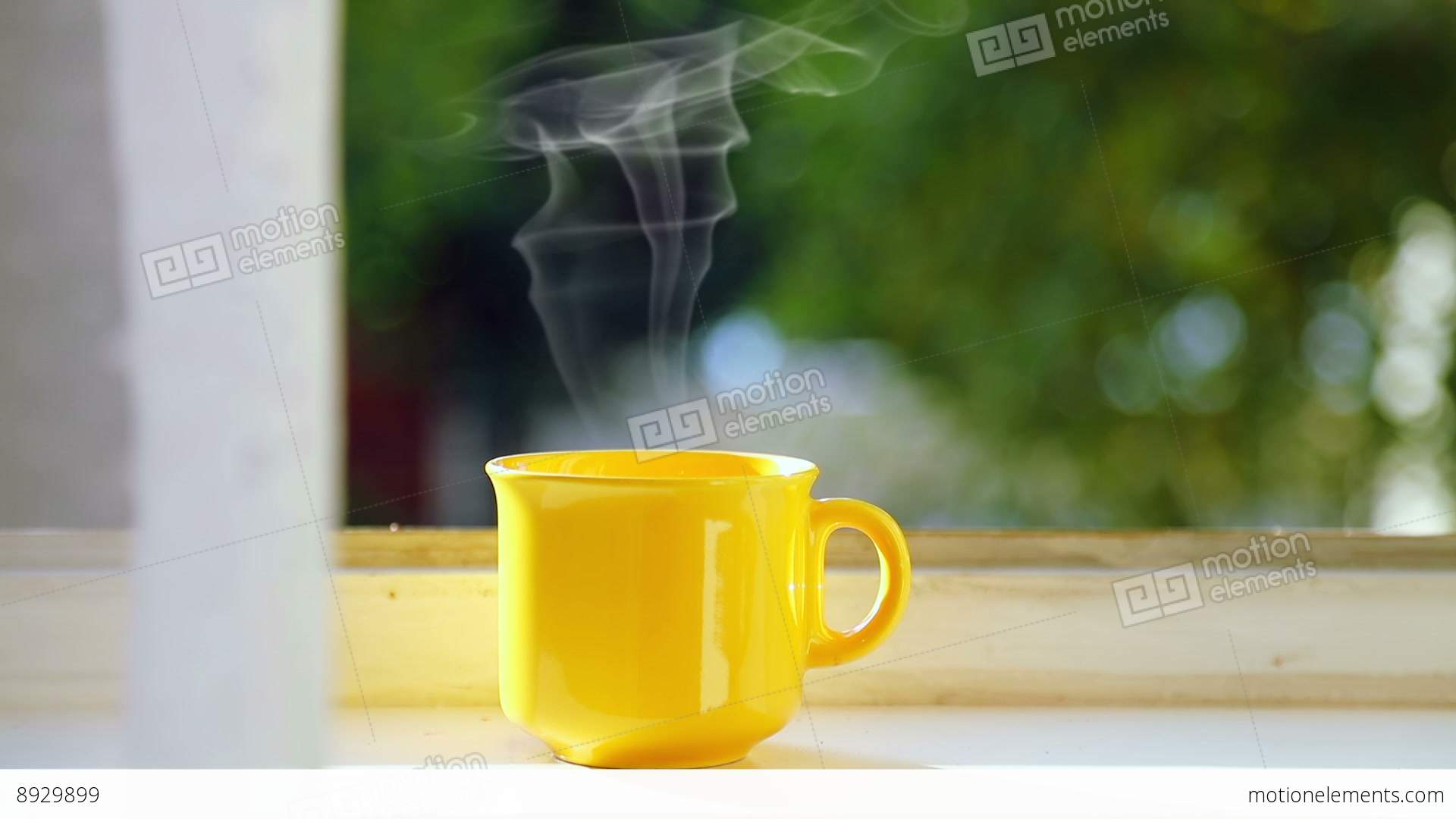 Yellow Cup Of Coffee On The Windowsill Stock video footage | 8929899