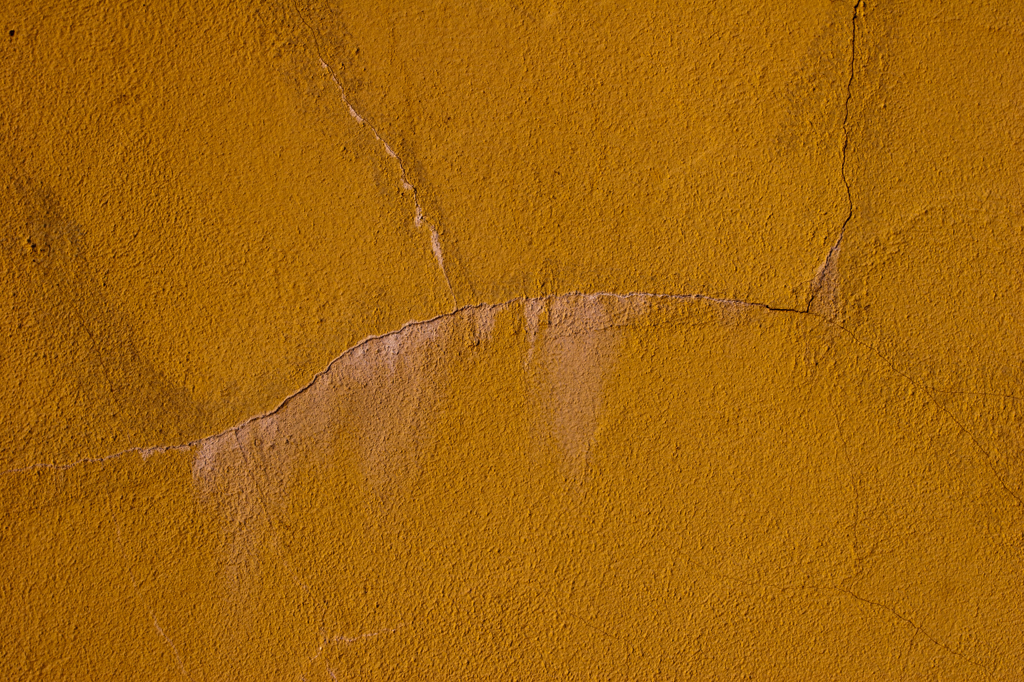 Yellow grunge wall texture photo