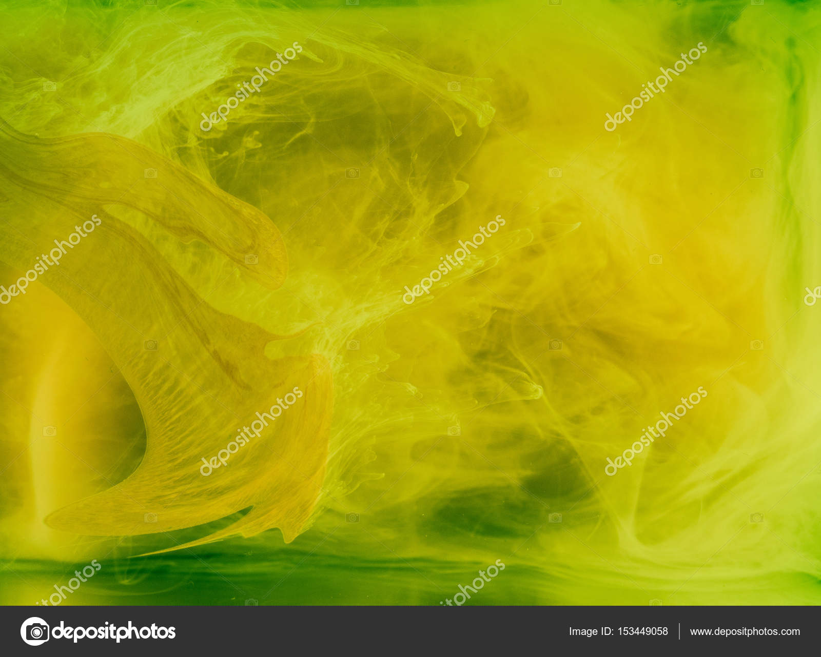 Abstract colored background. Yellow smoke, ink in water, the ...