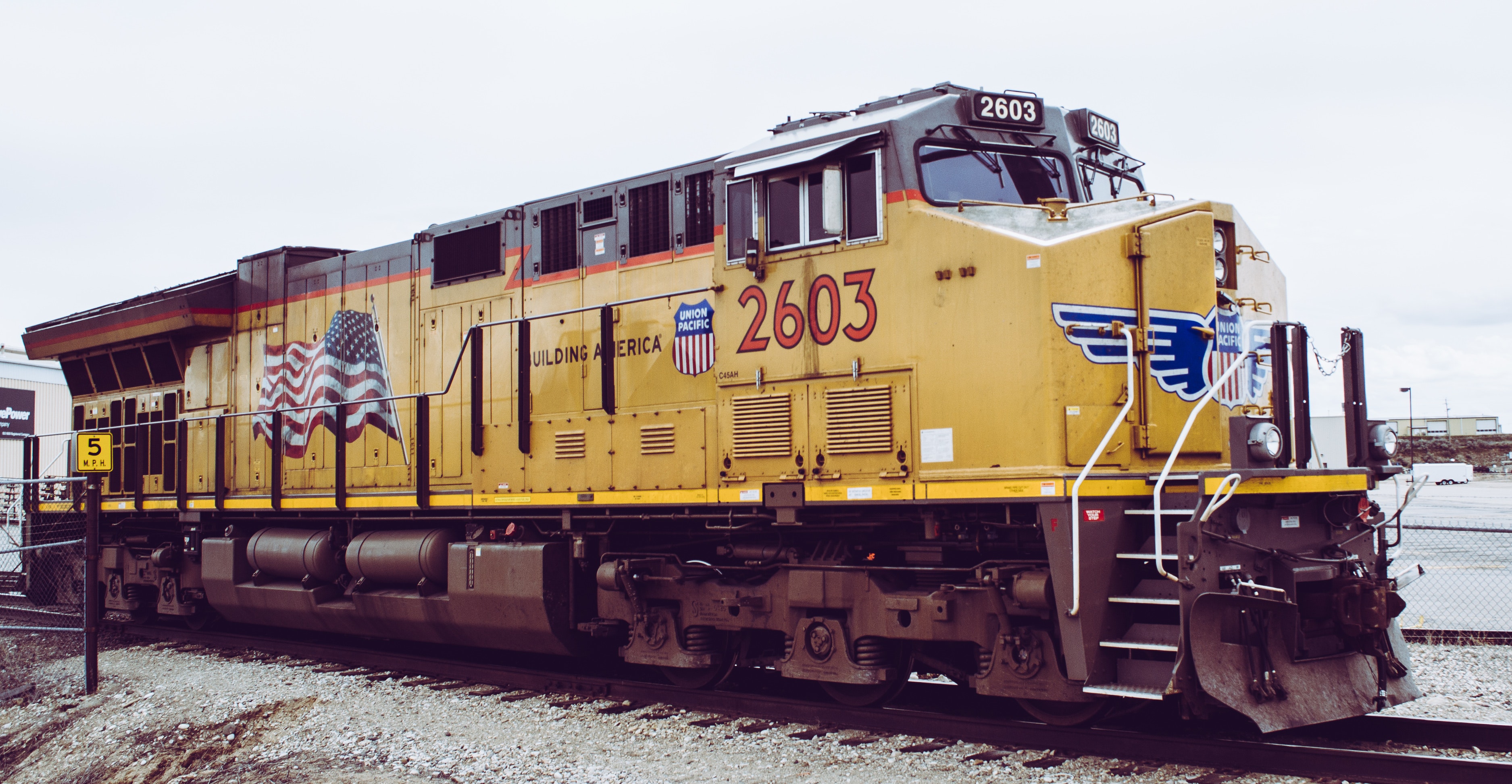 Yellow train on rails photo