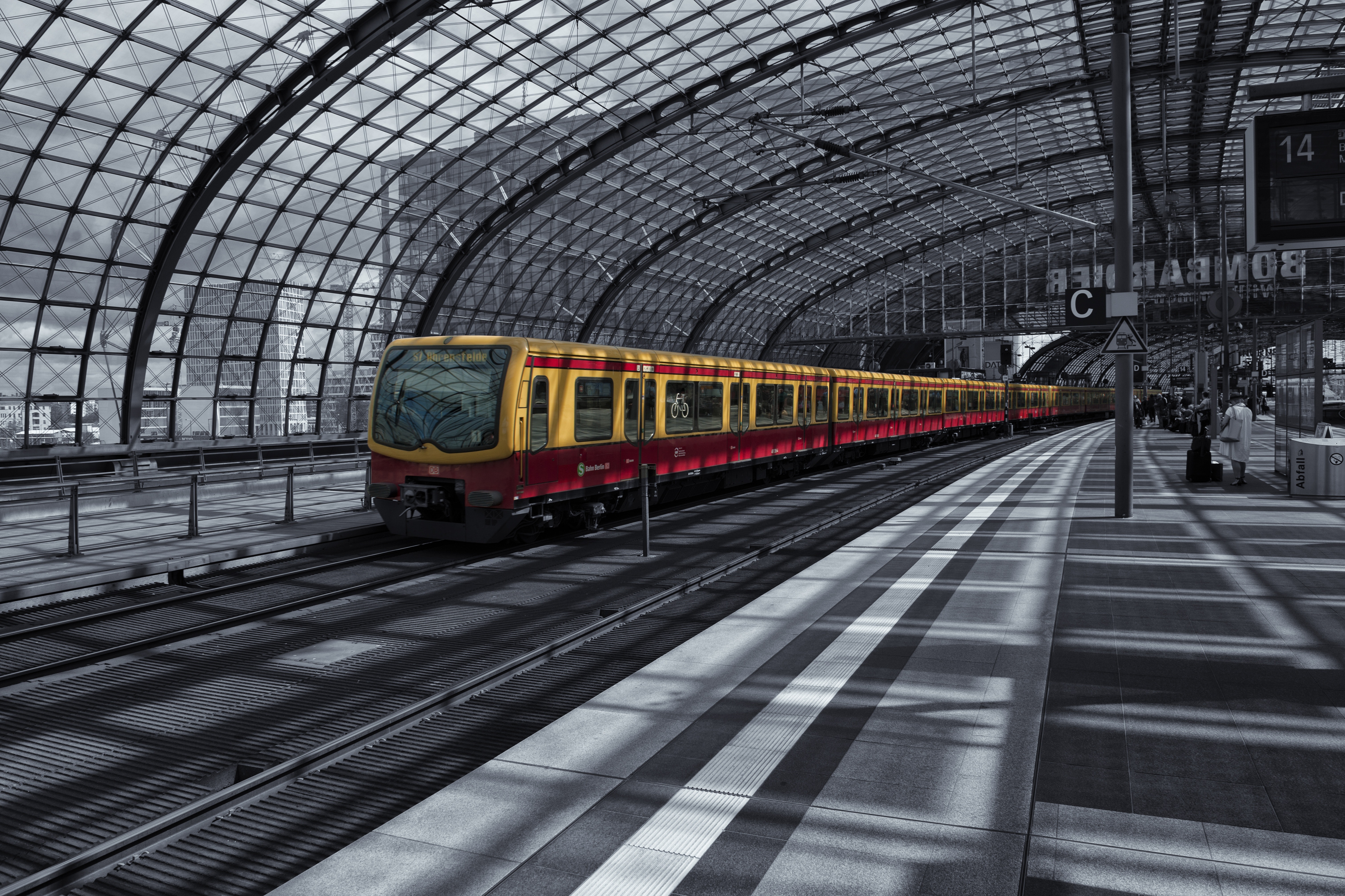 Yellow train on railway during daytime photo