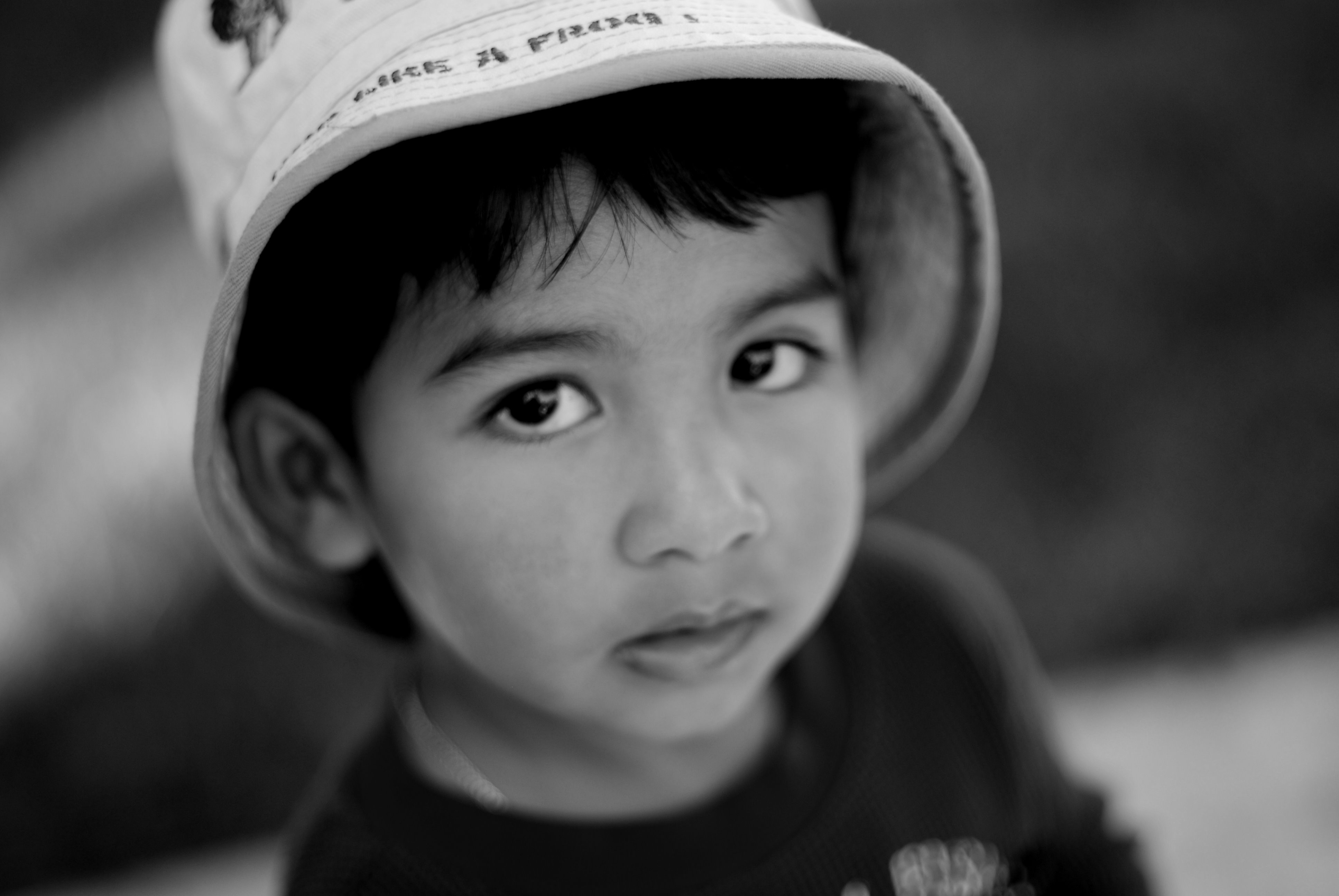 Young boy with a hat - b&w photo
