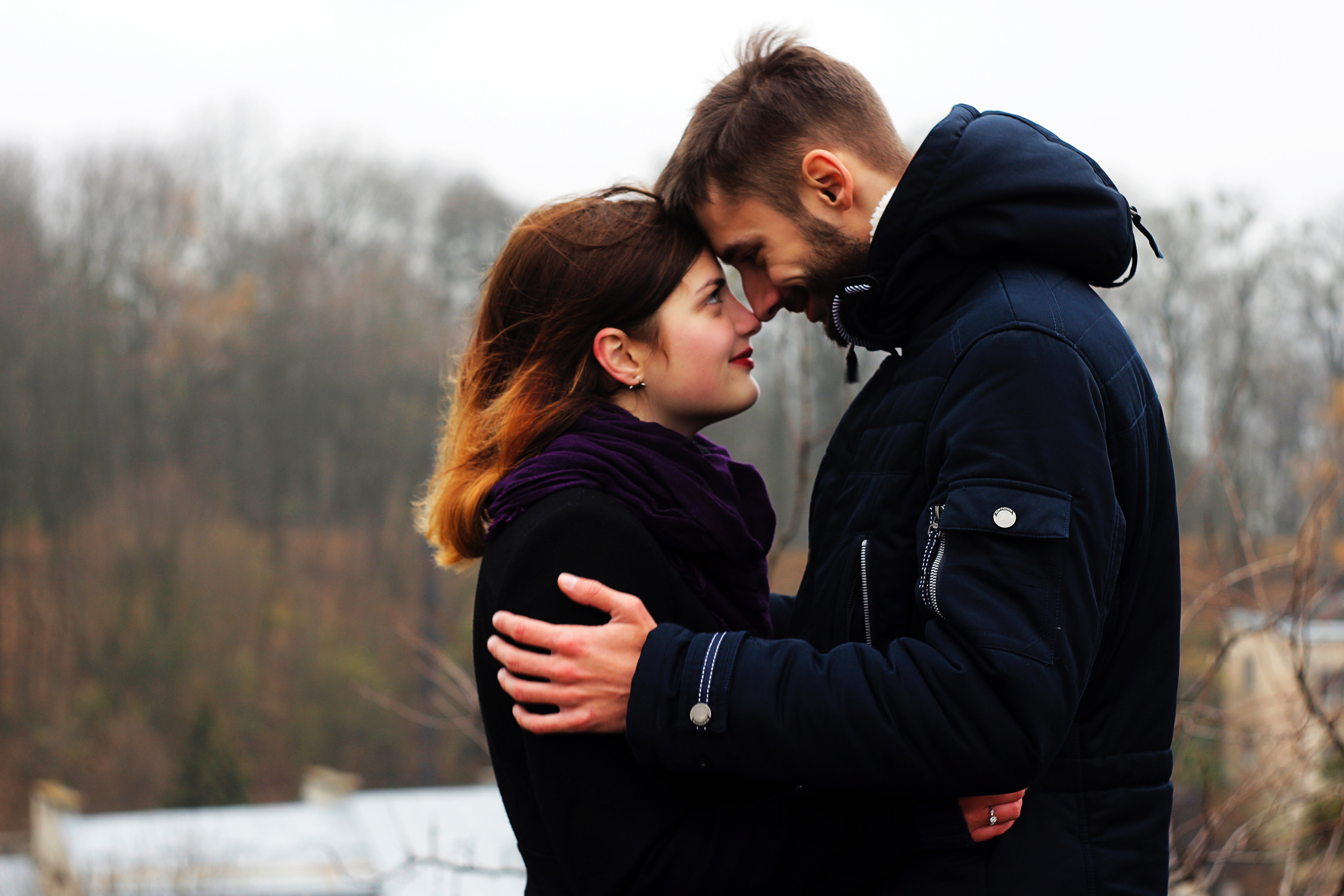 Young couple on woman during winter photo