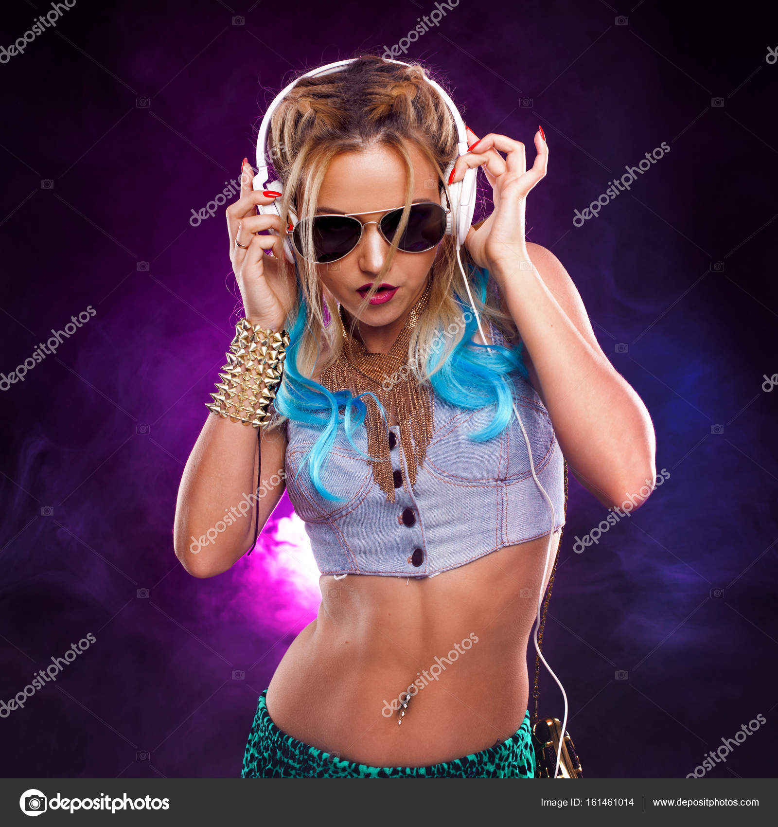 Young fashionable girl in disco style. Listening music and enjoying ...