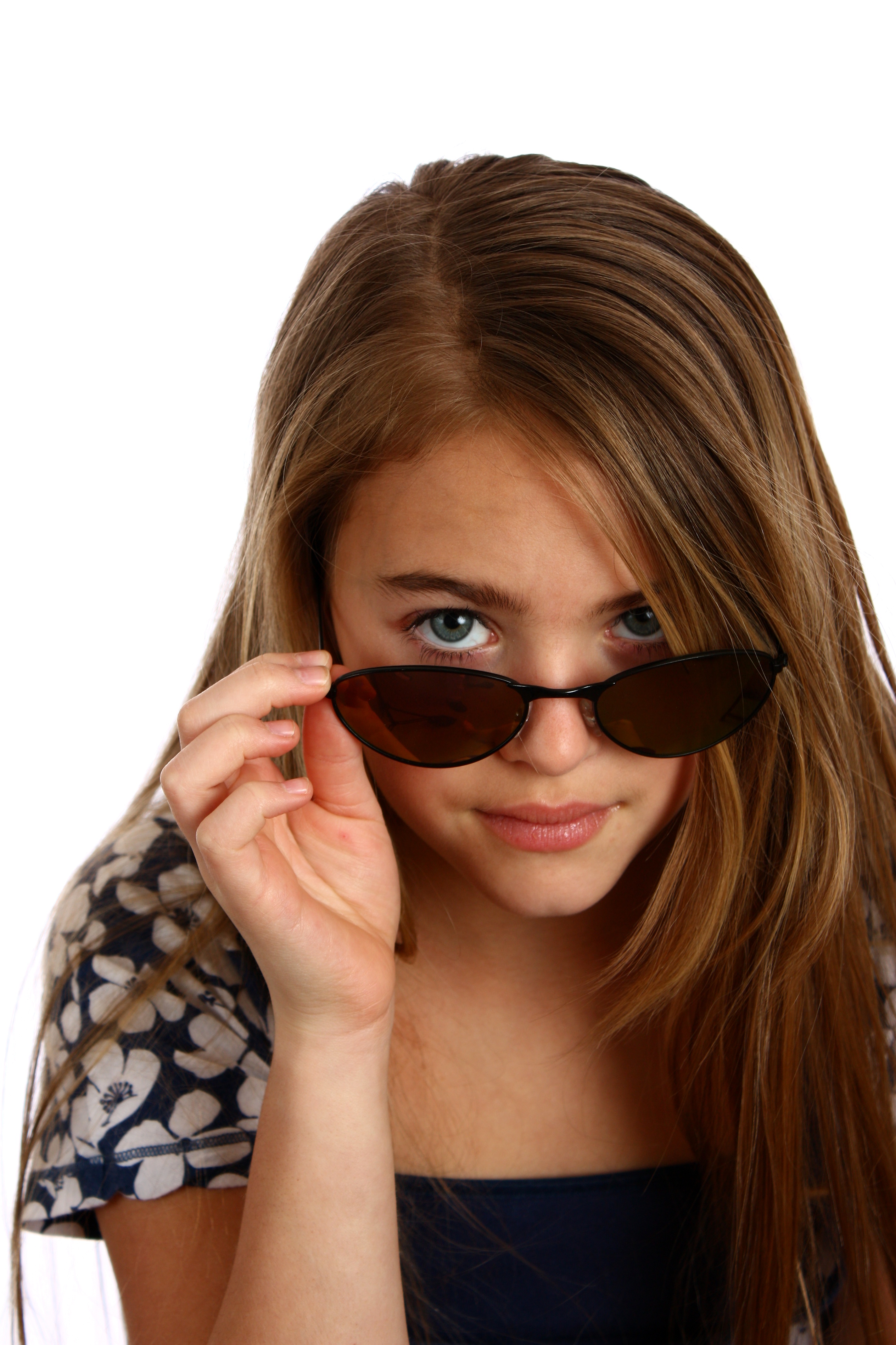 Young girl posing with sunglasses photo