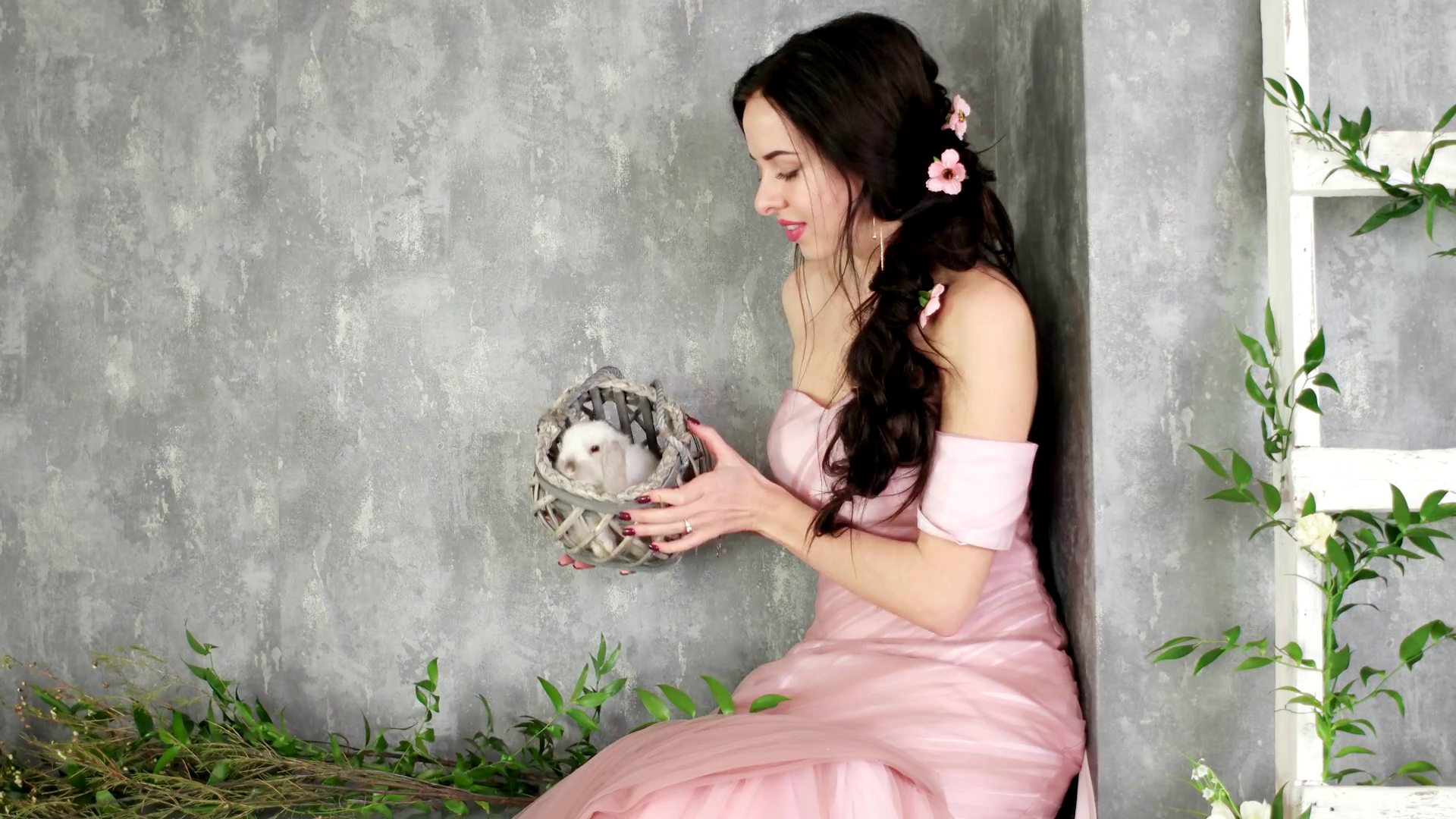 happy young lady having fun with white domestic rabbit in photo ...