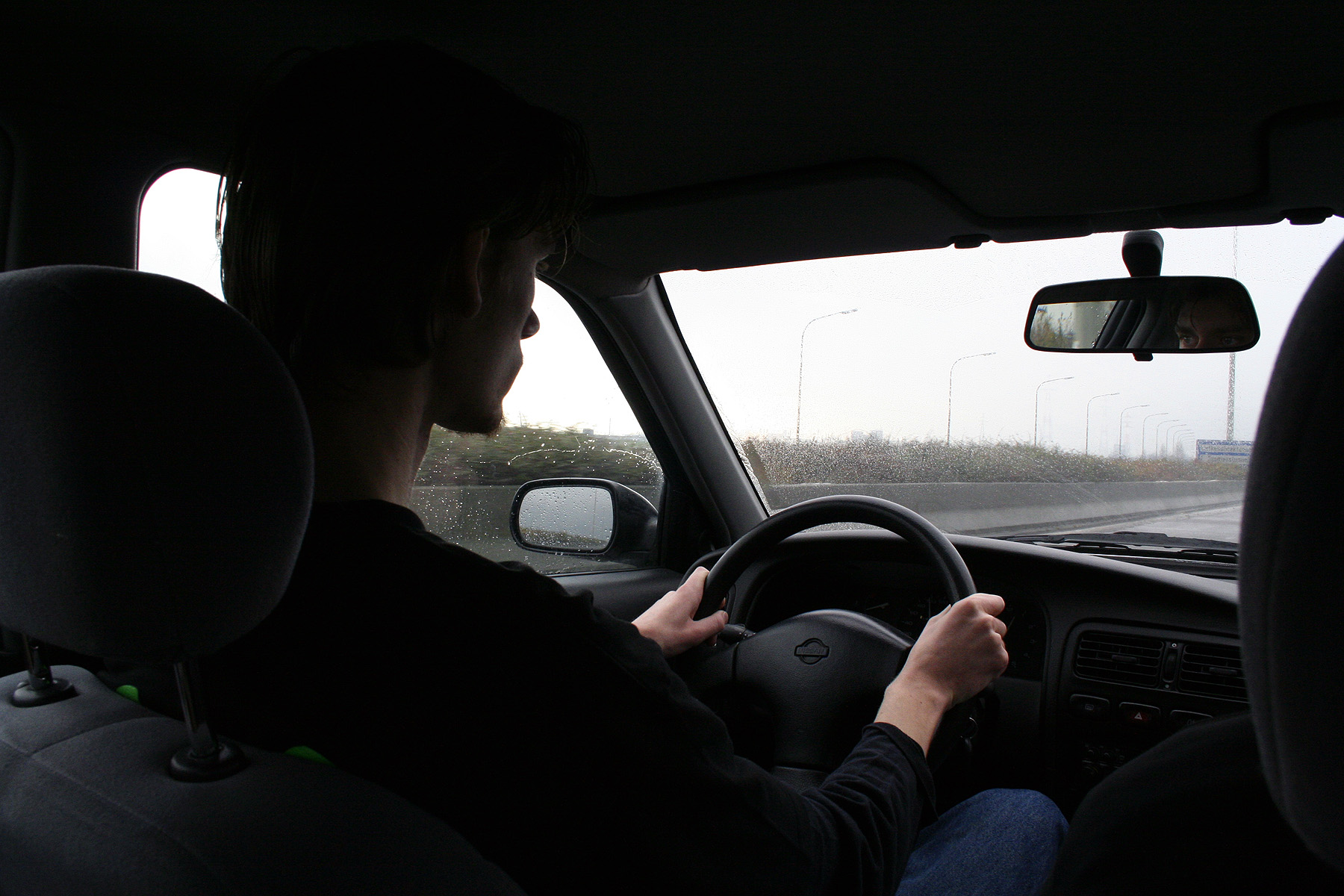 Young man driving photo