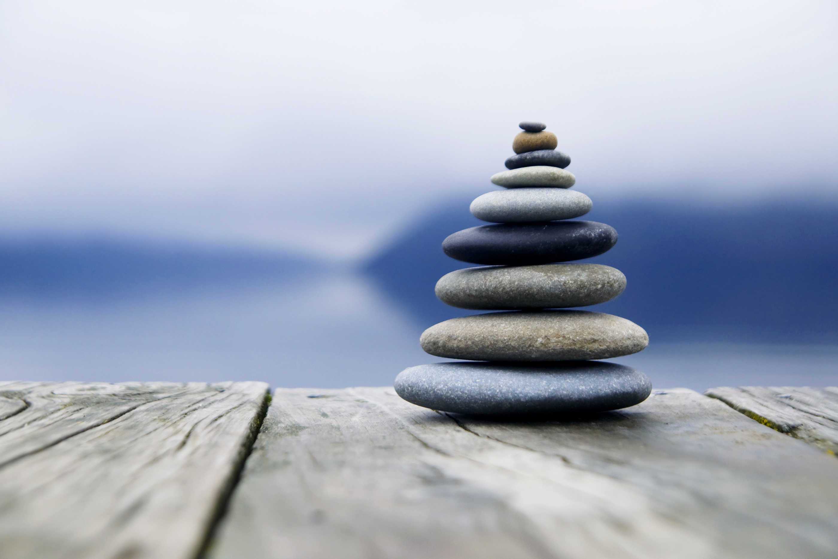 Zen Balancing Rocks o a Deck, New Zealand | Larry Berkelhammer