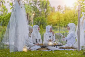 4 Women in White Abaya Wedding Gown Having Picnic Near Trees