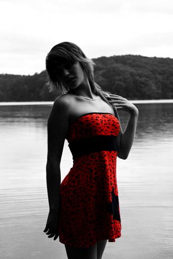 A beautiful woman posing in red dress