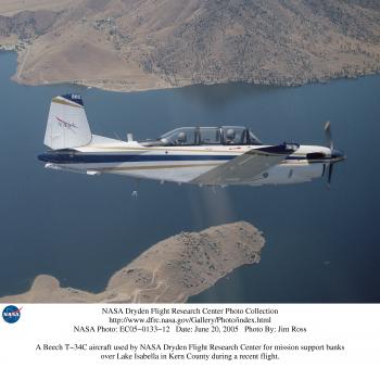 A Beech T-34C aircraft used by NASA Dryden Flight Research Center for mission support banks over Lake Isabella in Kern County during a recent flight.