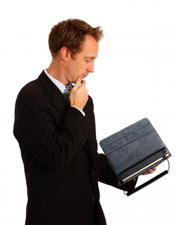 A businessman holding a tablet computer