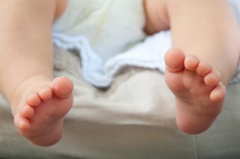 A close-up of tiny baby feet