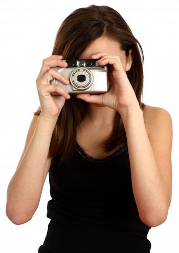 A cute young girl taking a picture