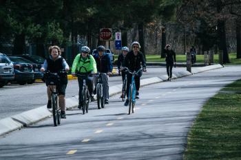 A group of cyclists make a walk around the city