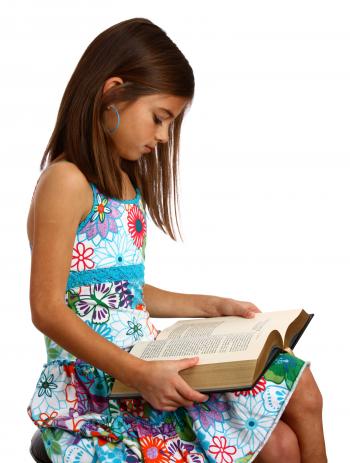 A pretty young girl reading a book
