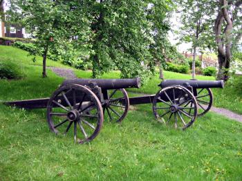 A small cast-iron cannon on a carriage