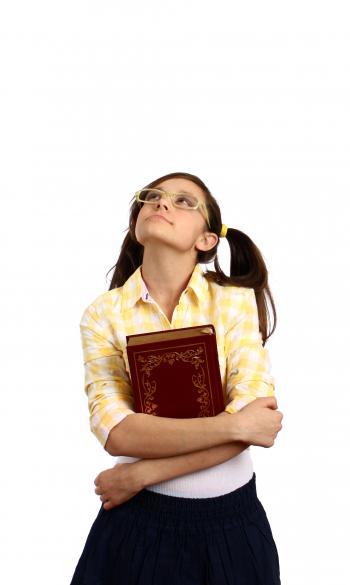 A smart girl with glasses holding a book