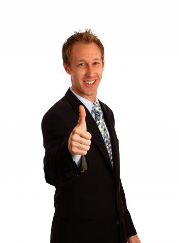 A Young Businessman Giving A Thumbs Up