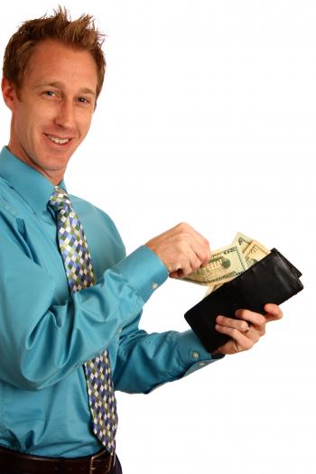 A young businessman holding a wallet