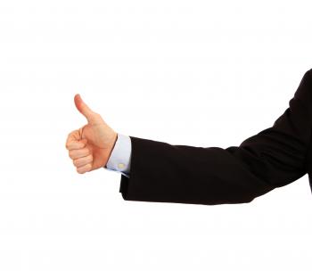 A young businessman making a thumbs up