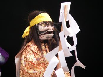 Actor wearing a traditional Japanese Kagura mask