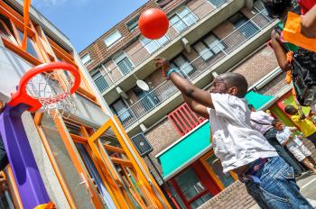African American boy playing basketball