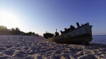 An old boat on the Mediterranean coast in Greece Stock Video Footage ...