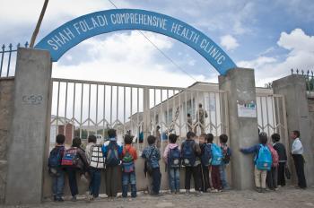 File:Afghan students at the gate of a clinic.jpg - Wikimedia Commons