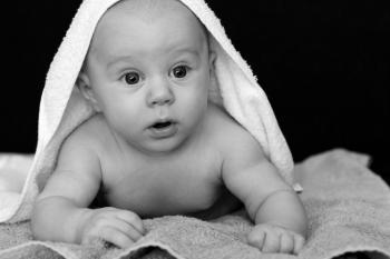 Baby Covered by White Towel Grayscale Photography