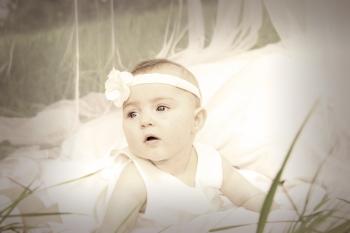 Baby in White Tank Dress and Headband