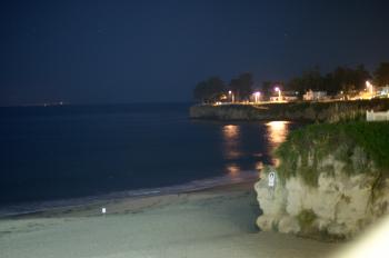 Beach and cliffs at night
