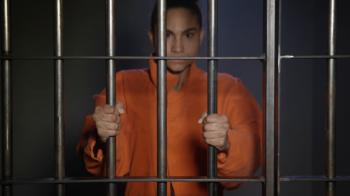Young woman behind bars in jail cell Stock Video Footage - Videoblocks