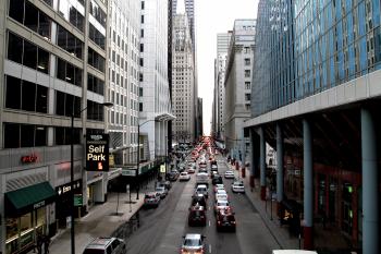 Free Stock Photo of Street Traffic in Between City Buildings