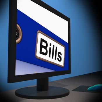 Bills On Monitor Showing Paying Expenses