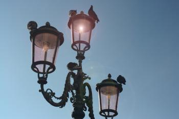 Black 3-light Post Lamp Under Blue Sky