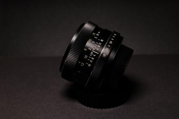 Black Camera Lens on Black Textile