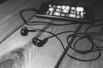 Black earphones on a desk