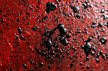 Black paint on red canvas