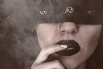 Blindfolded Woman With Finger on Lips Grayscale Portrait