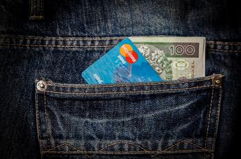 Blue Card and 100 Banknote in Pocket
