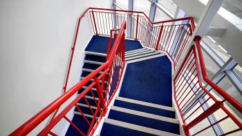 Blue Stairs and Red Handled on White Paint Wall