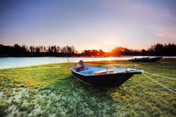 Boat on Body of Water during Sunset