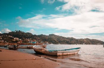 Boats On Seashore During Daytime