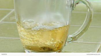 Boiling Water Poured Over A Tea Bag In A Clear Glass Coffee Cup ...
