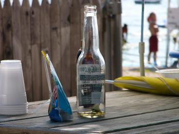 File:Beer bottle on a picnic table at the beach.jpg - Wikimedia Commons