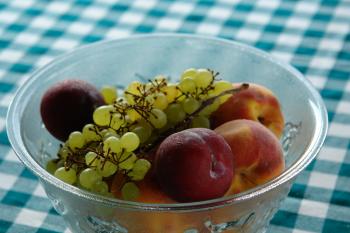 Bowl of peaches and grapes