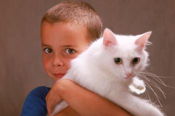 Boy holding a cat